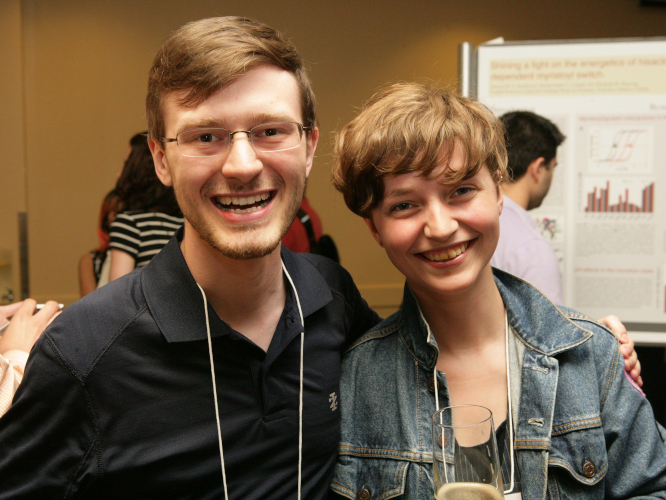 Photograph of Zachary Jacobi and I, at a protein engineering conference. Zach's arm is around my shoulder but, like, in a friend way.