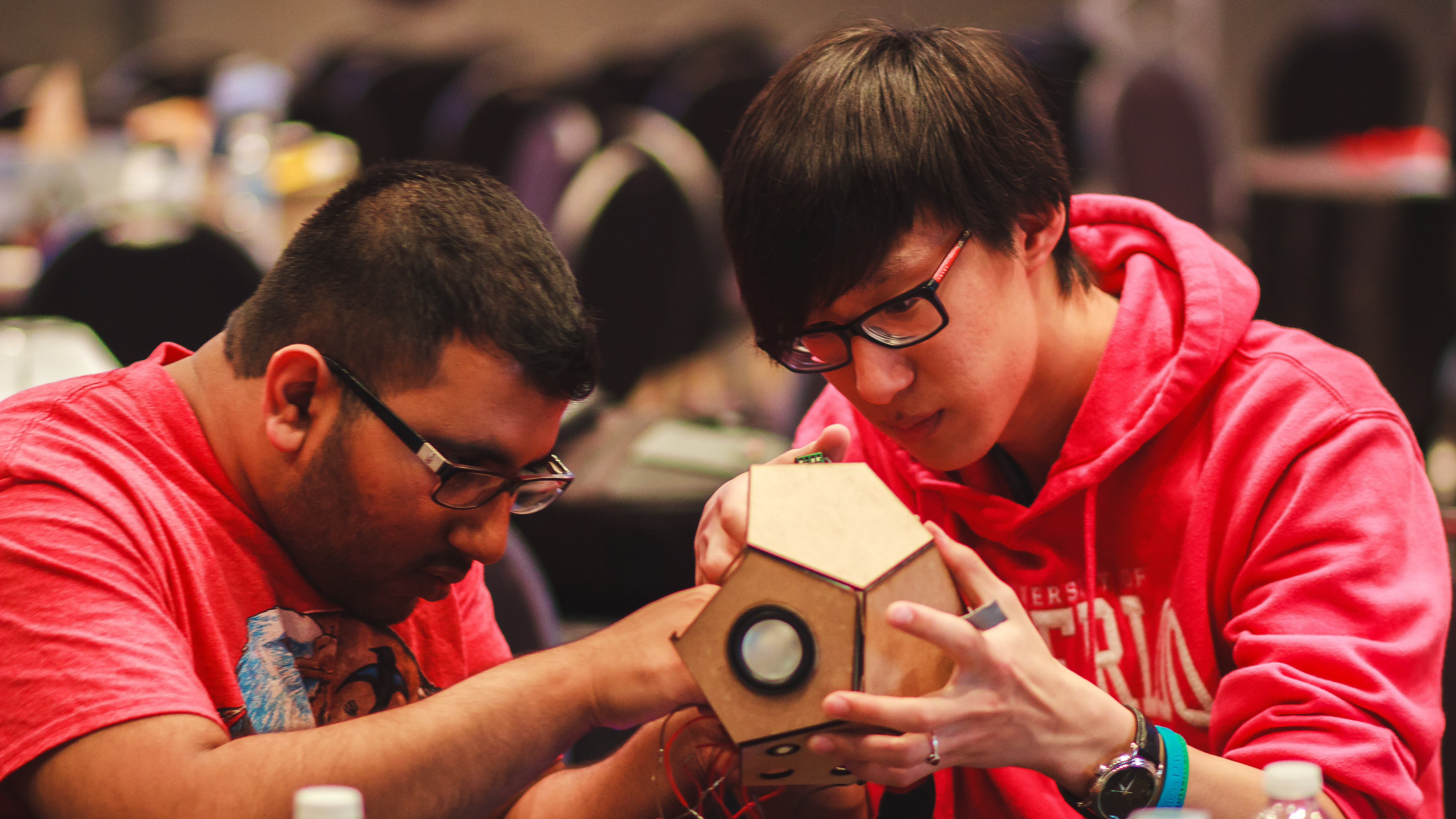 Team members Michael and Navin putting together the prototype